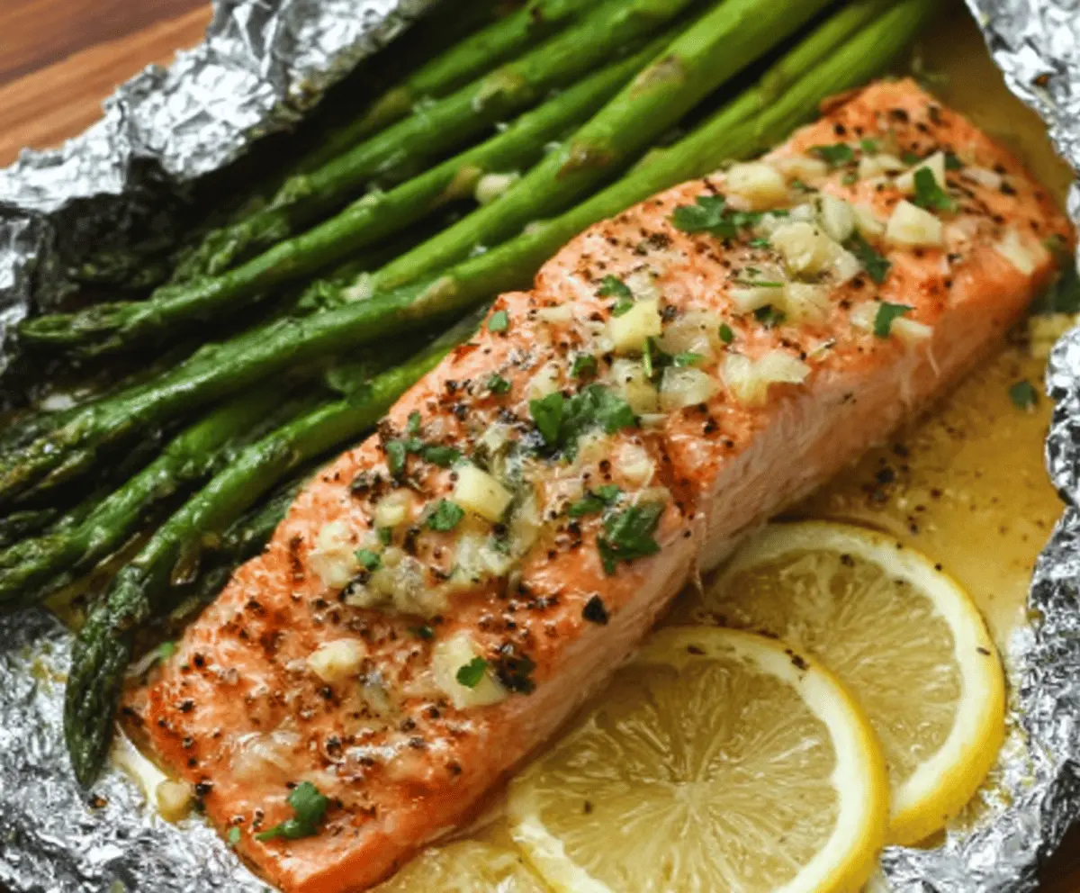 Baked Salmon In Foil With Asparagus And Lemon Garlic Butter Sauce