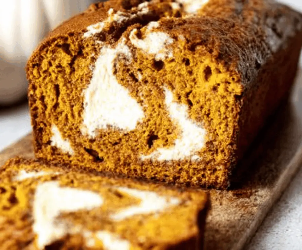 Delicious homemade pumpkin bread with creamy cream cheese swirl and fall spices, perfect for autumn baking