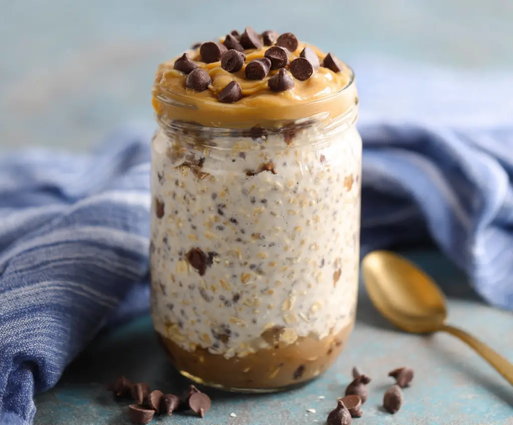 Creamy Cookie Dough Overnight Oats topped with chocolate chips and a sprinkle of cookie crumbs for a delicious breakfast.